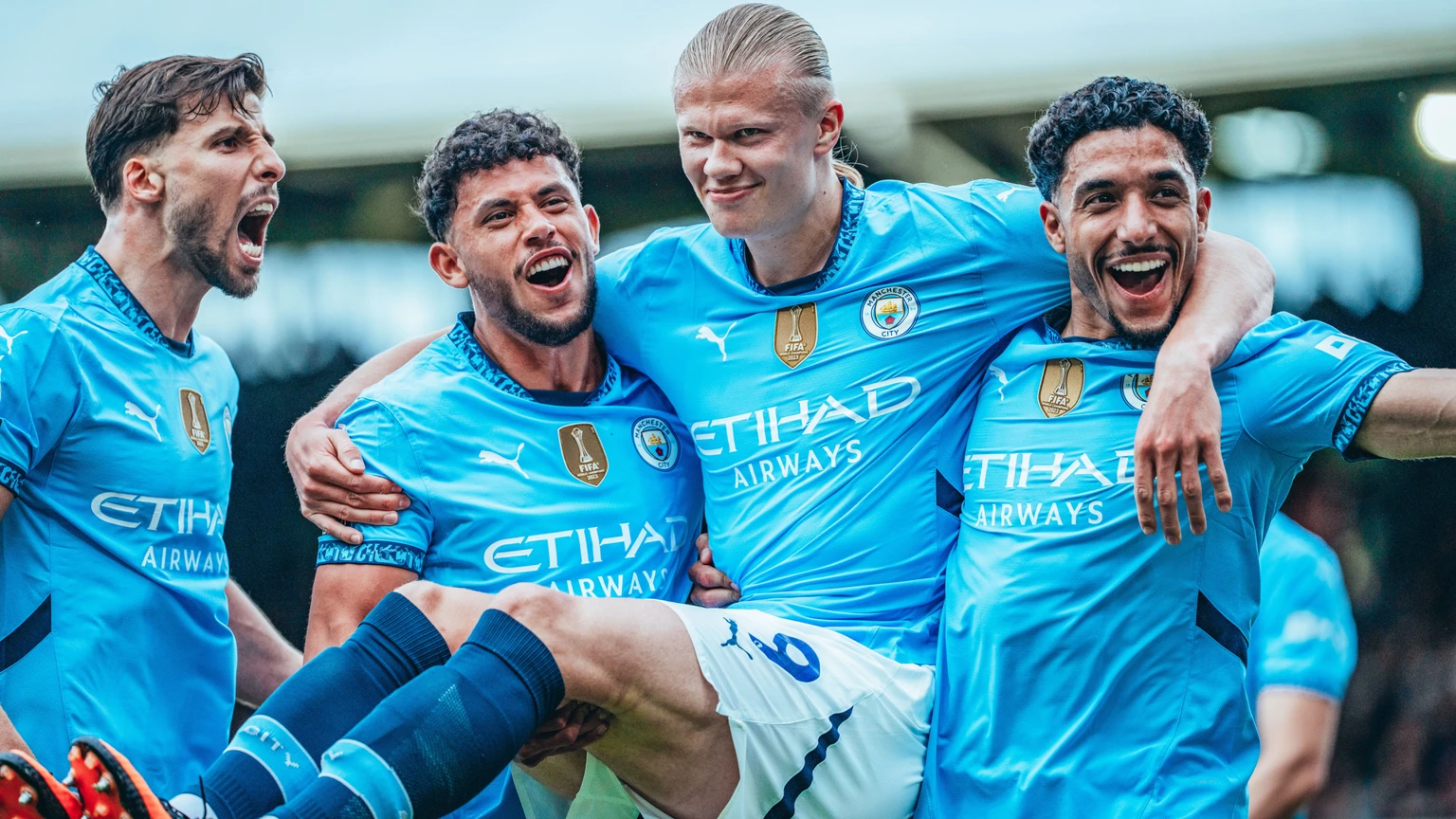Football players celebrating together after a successful team performance
