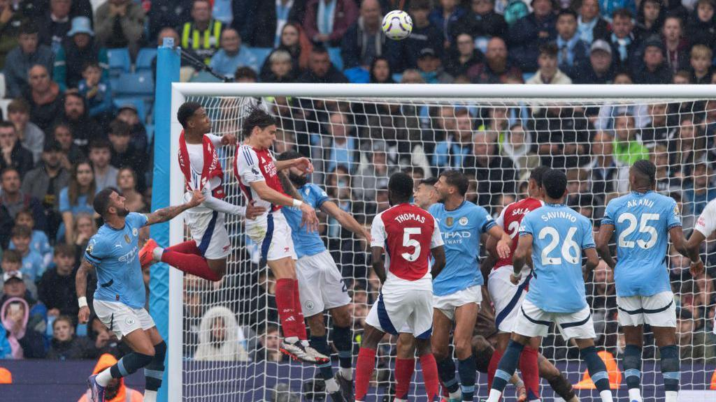 Arsenal FC attacking a deep corner at the far post.