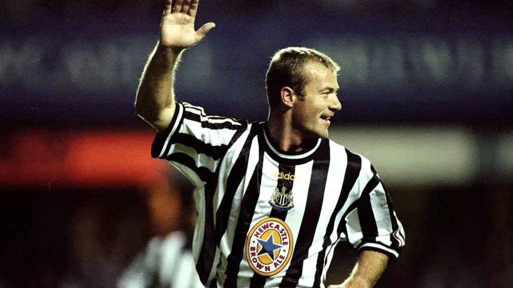 Shearer celebrating a goal.